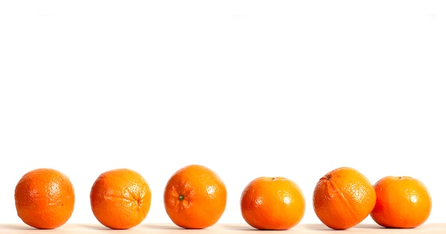 Variation of ripe oranges fruit on wooden table 