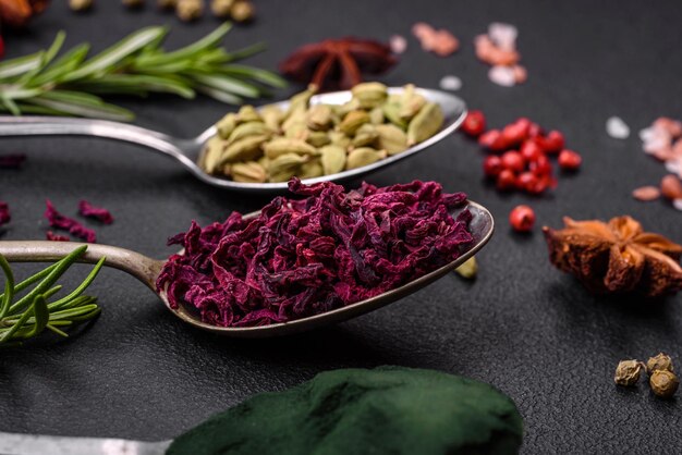 Premium Photo | Variation of spices in metal spoons paprika turmeric ...
