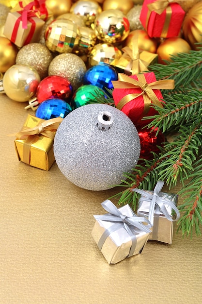 Varicolored Christmas decorations on a spruce branch