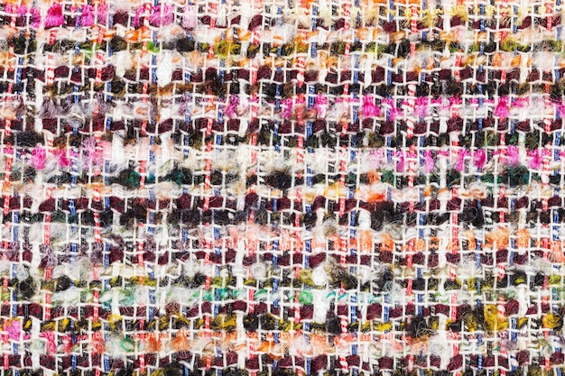 Photo varicoloured woven yarns of boucle fabric close up