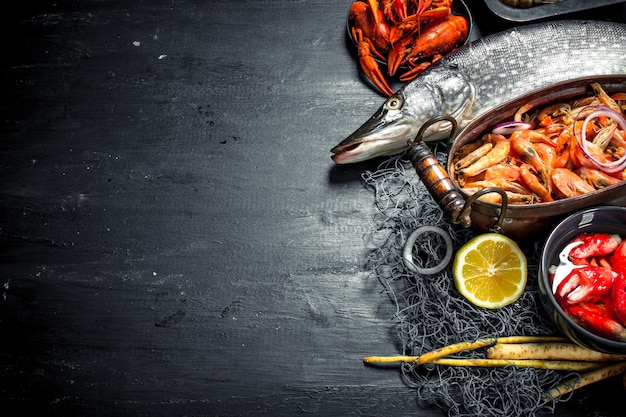 Varied fresh seafood. On the black chalkboard.