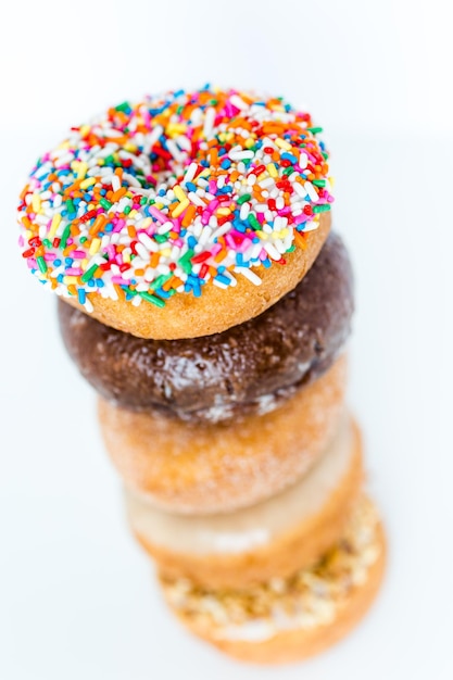 Variery of fresh donuts on a white background.