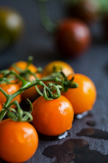 Varieties color of Cherry Tomatoes on stone board