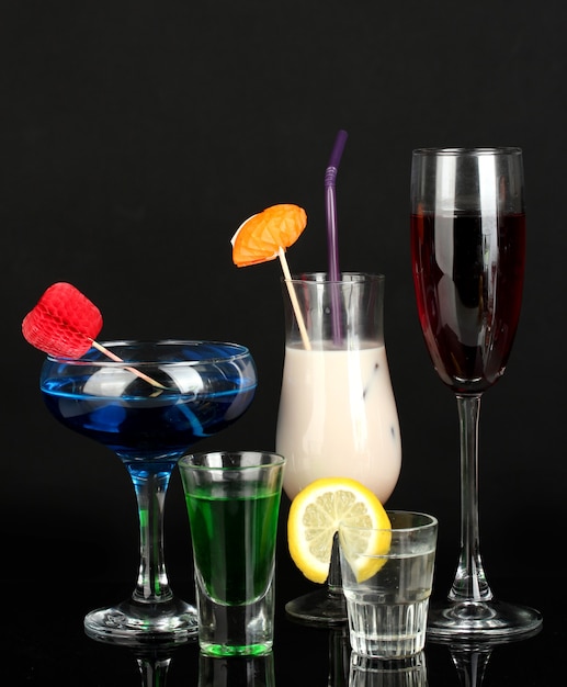 Photo a variety of alcoholic drinks isolated on black