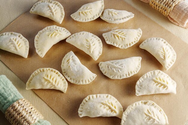 Variety of beautifully crafted dumplings artfully assembled on a wooden cutting board