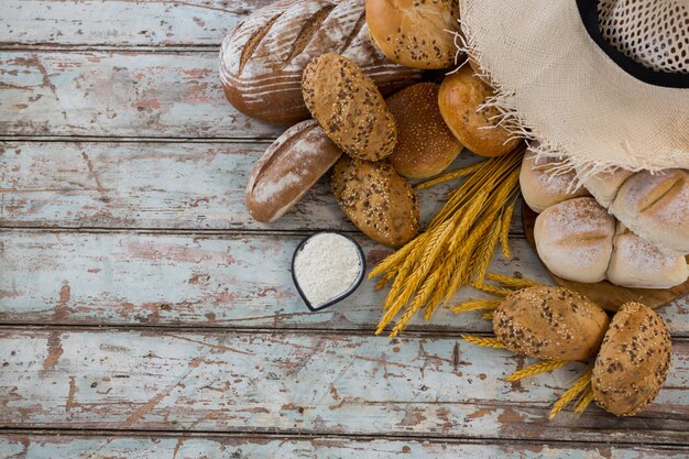 Variety of breads with wheat grains and flour