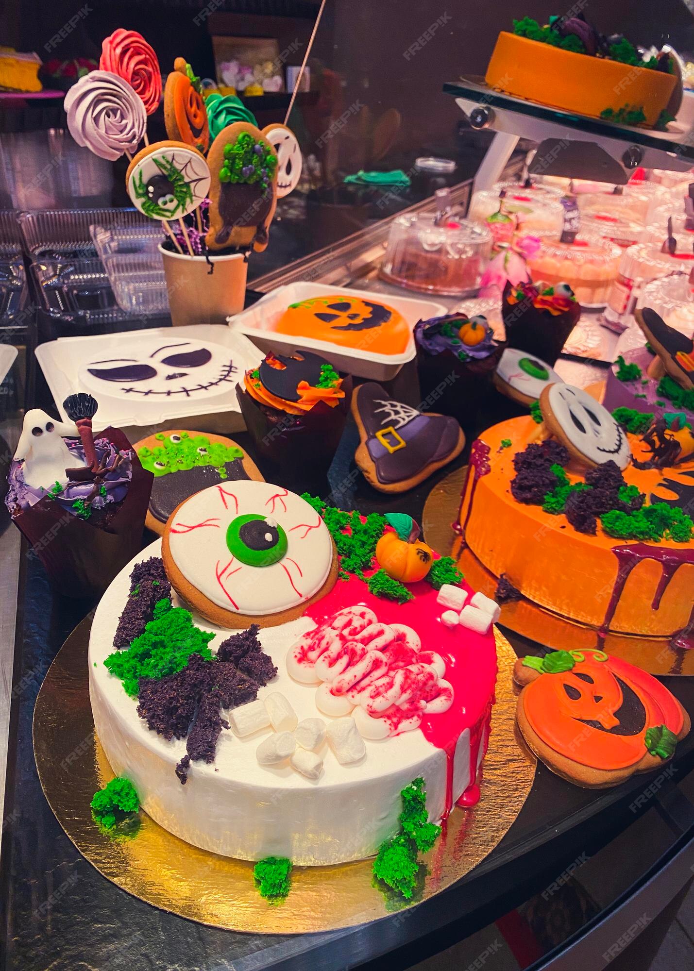 Premium Photo | Variety of cakes decorated in style of halloween ...