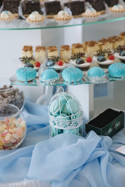 Variety of candies, cakes and cupcakes at the candy bar