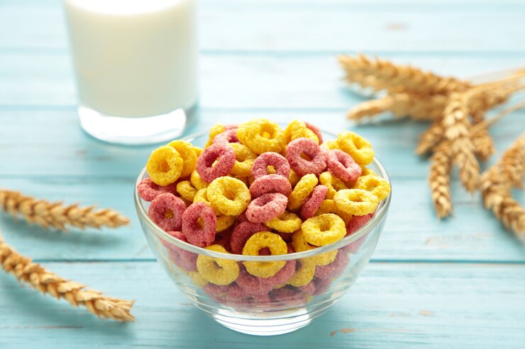 Photo variety of cereals in blue bowls, quick breakfast on purple background. vertical photo