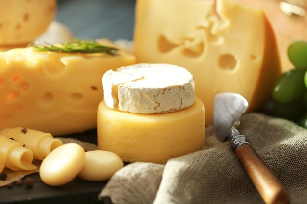 Variety of cheese on wooden table