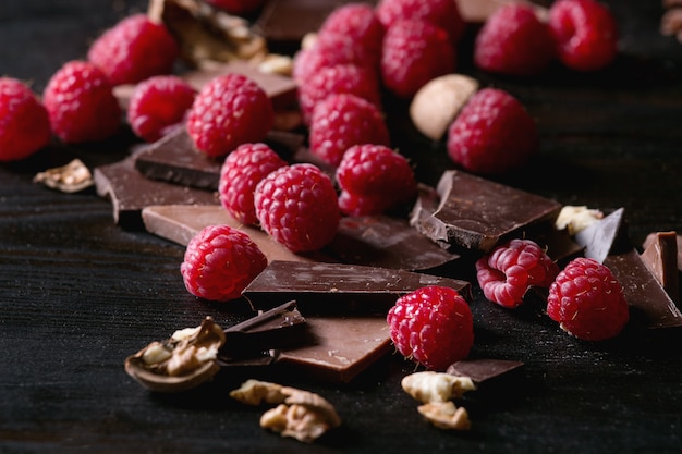 Variety of chopping chocolate with raspberries