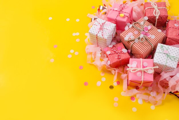 Photo variety of christmas gifts on a yellow background