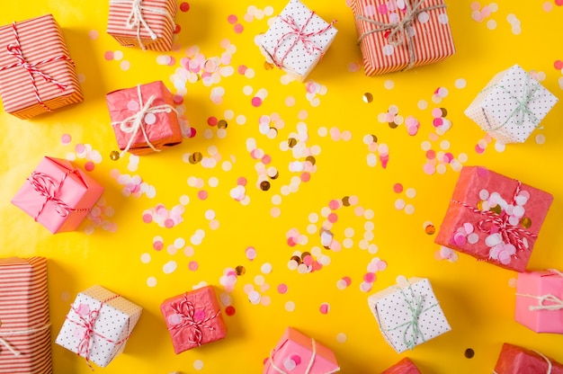 Variety of Christmas gifts on a yellow background