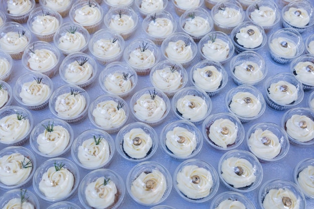 a variety of cupcakes are displayed on a table