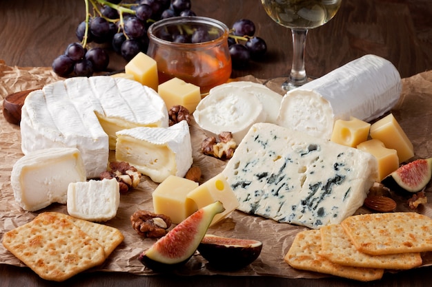 Variety of different cheese with wine