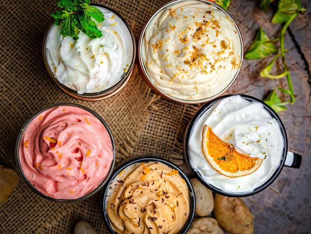 A variety of different flavors of sweet potato salad are on a table.