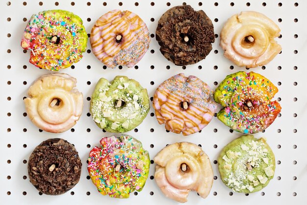 Photo variety of donuts on a peg board