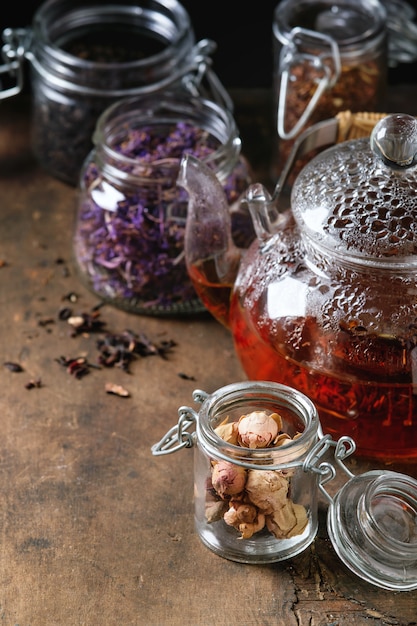 Variety of dry tea with teapot