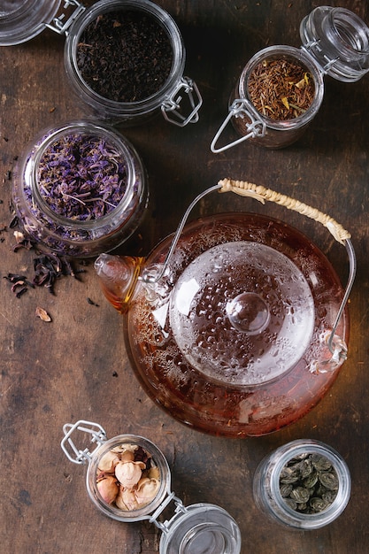 Variety of dry tea with teapot