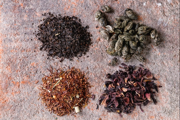 Variety of dry tea with teapot