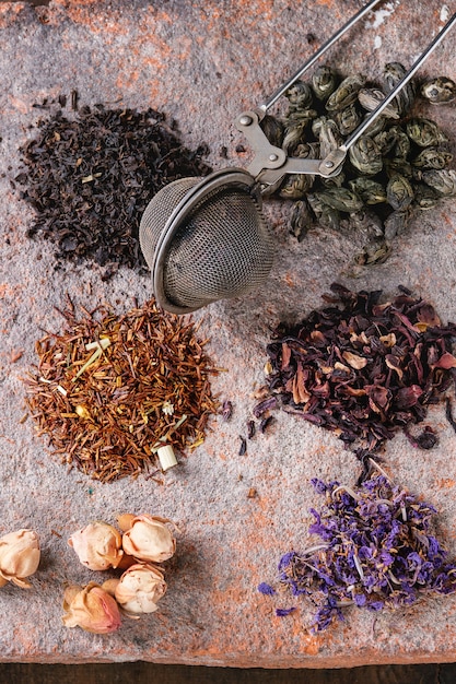 Variety of dry tea with teapot