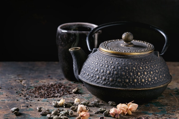 Variety of dry tea with teapot