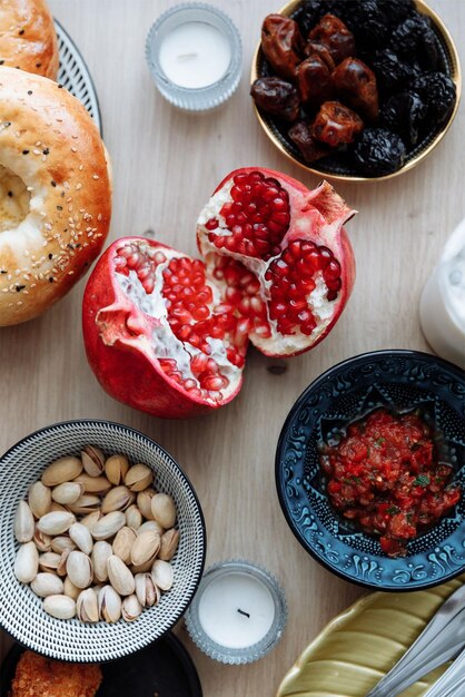 A variety of food including a pomegranate jam and other foods