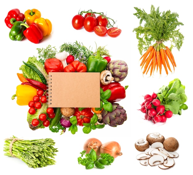 variety fresh herbs and vegetables and recipe book