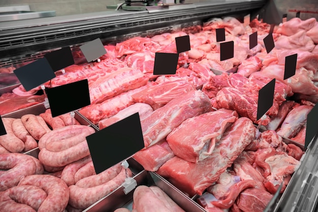 Photo variety of fresh meat in supermarket