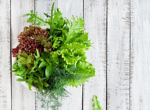 Variety fresh organic herbs in rustic style