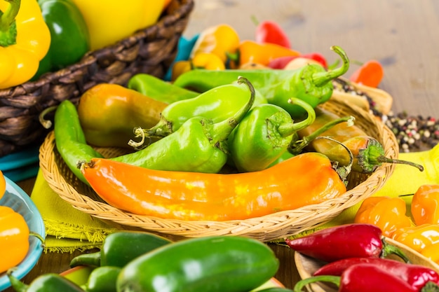 Variety of fresh organic peppers on the table.