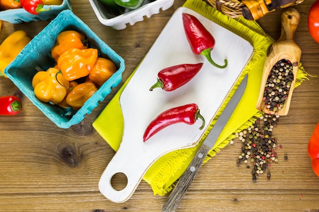 Variety of fresh organic peppers on the table.