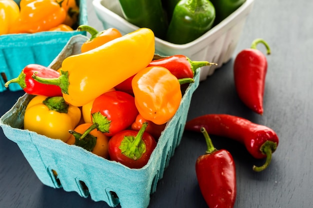 Variety of fresh organic peppers on the table.