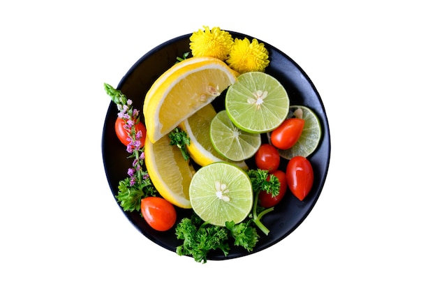 Variety fruits of Lemon Lime Tomato and Parsley in a bowl