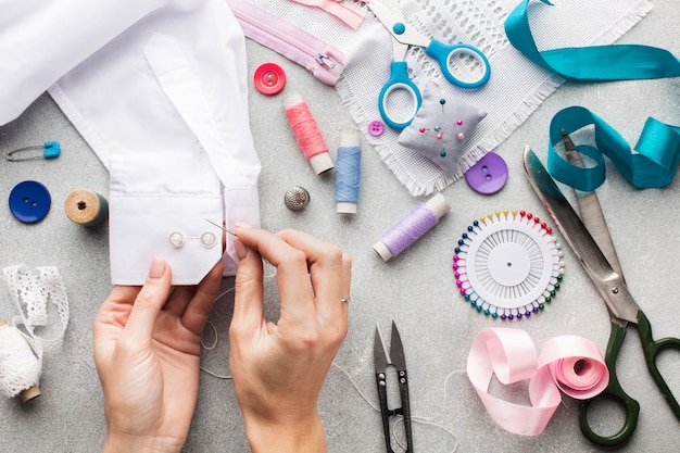 Variety of haberdashery colourful accessories and hands