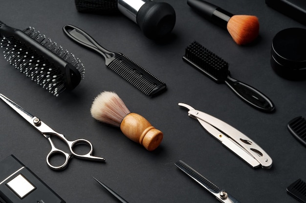 Variety of hair styling tools and accessories displayed on a dark background