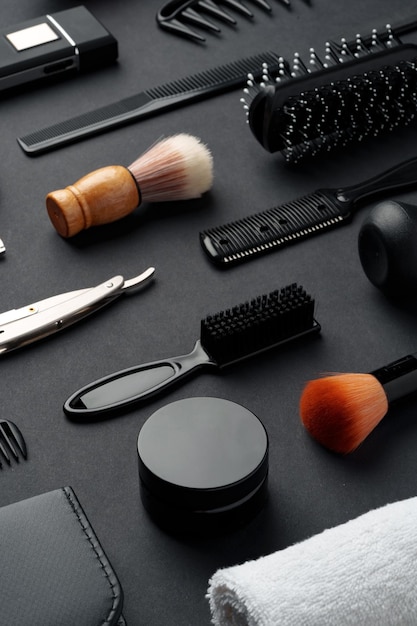 Variety of hair styling tools and accessories displayed on a dark background