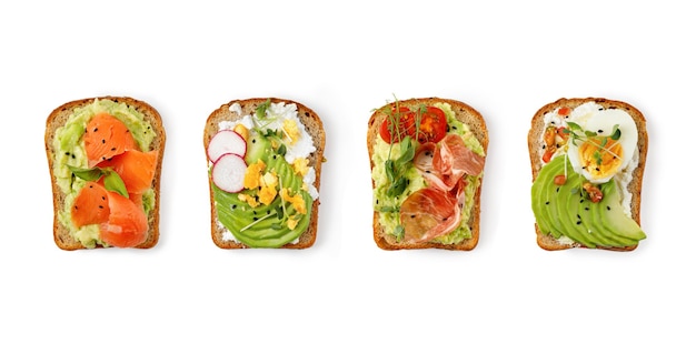 Variety of healthy sandwiches set of toasts with avocado slices\
of avocado assorted toasts