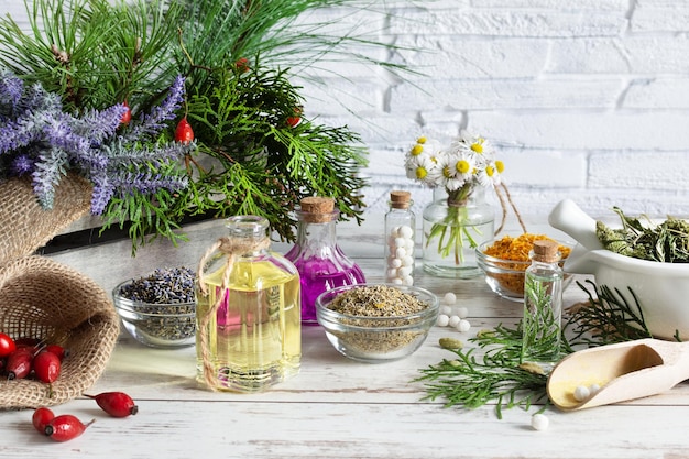 Variety of herbs and herbal mixtures as an alternative medicine concept on wooden table background