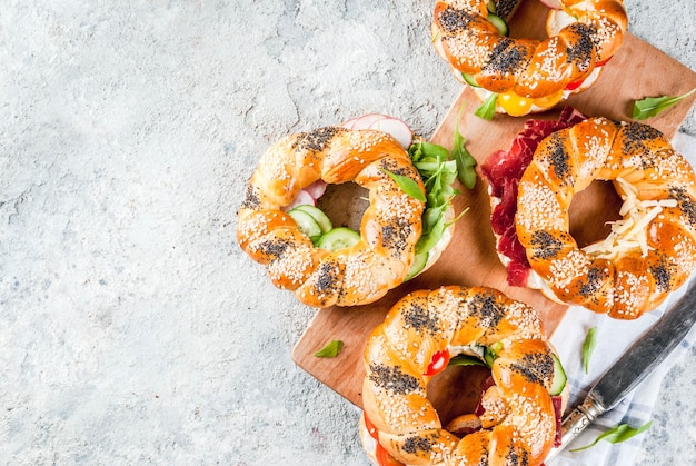 Variety of homemade bagels sandwiches with sesame and poppy seeds