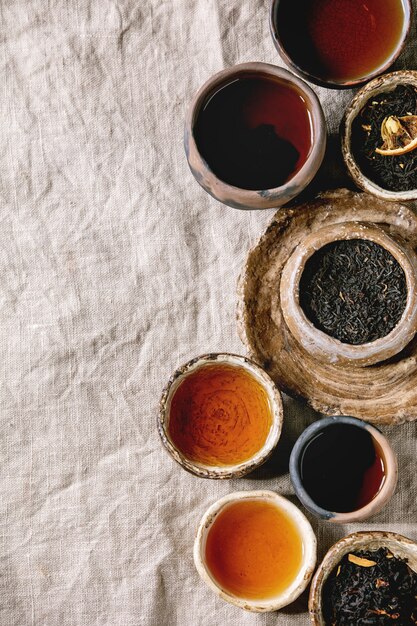 Variety of hot and dried tea in bowls