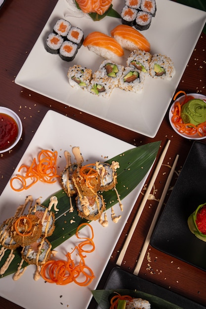 Variety of Japanese food dishes on the wooden table. Vertical picture