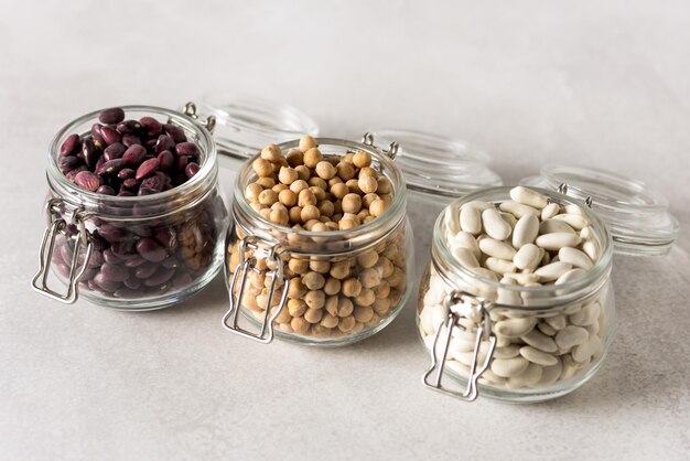 Variety of Legumes in Glass Jars Red and White Kidney Beans Chickpeas Horizontal