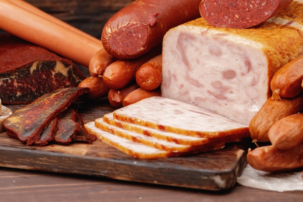 Variety of meat and sausage products on table