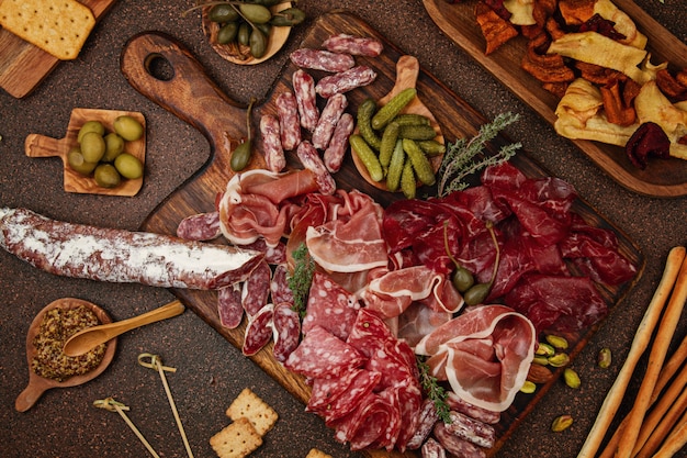 Variety of meat on a wooden tray