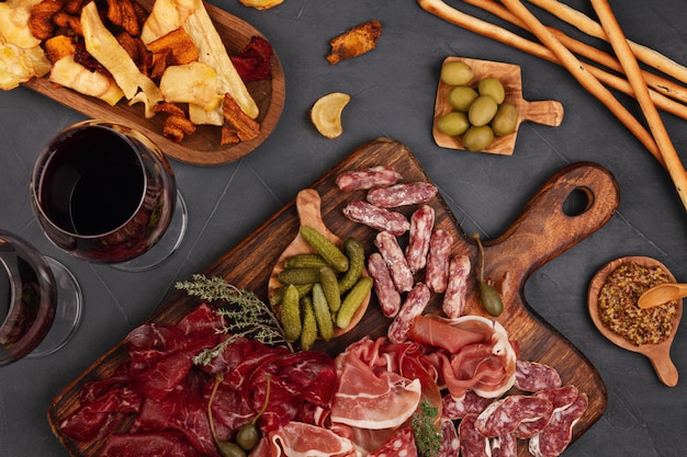 Variety of meat on a wooden tray