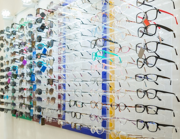 A variety of medical and sunglasses on the stand in the store