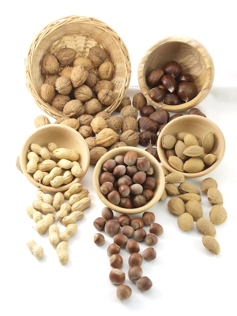 A variety of nuts are displayed on a table.