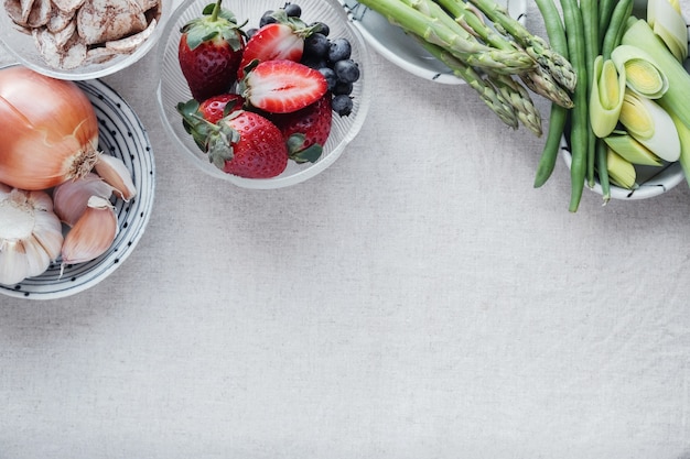 variety of prebiotic foods, raw green banana, asparagus, onions, garlic, leeks