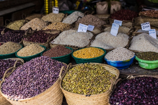 Variety of rice and beans on the market in Stone Town, Zanzibar. African market counter